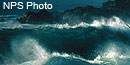 Waves crashing on rocks during a storm.