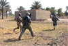 U.S. and Iraqi soldiers search farmhouses and other buildings in southern Muehla as part of Operation Dodge City II, Aug. 4, 2008. 