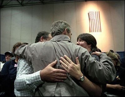 President Bush consoles a family during his to trip to New York Sept. 14, 2001.