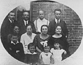 Mordecai Gebirtig, second from right, top row, with family and friends. Cracow, Poland, 1924.