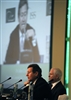 John Chipman, foreground, chief executive officer of the International Institute for Stategic Studies, introduces U.S. Defense Secretary Robert M. Gates during the opening of the fifth annual Manama Dialogue in Bahrain, Dec. 13, 2008. 