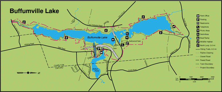 A map of Buffumville Lake showing the lakeshore trail, recreation sites, and roads.  The lake is in blue, the boundary line is red, and the surrounding land is green.