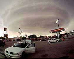researchers in mobile mesonet evaluate a distant supercell and discuss storm intercept strategy