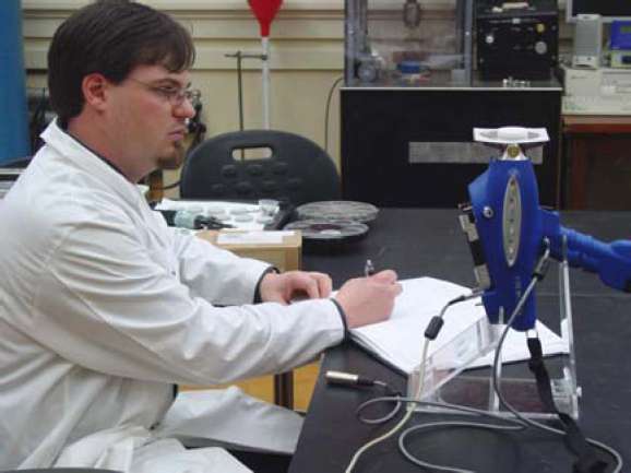 Figure 12. Jason Church uses the XRF spectrometer to analysis a marble sample after artificial
weathering.