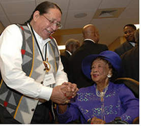 Clayton Old Elk of the Indian Health Service greets Dr. Dorothy Height