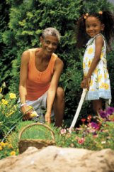 Photo of a woman and her granddaughter in the garden.