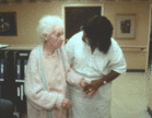 Photo of woman with Alzheimer's and nurse. - Click to enlarge in new window.
