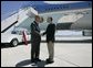 President George W. Bush talks to Freedom Corps Greeter Dr. Tom Hesch in front of Air Force One after arriving in Albuquerque, New Mexico, Wednesday, Aug. 11, 2004. Dr. Hesch has donated over $18,000 in dental care to disadvantaged people in the Albuquerque area through Donated Dental Services of New Mexico. White House photo by Eric Draper.