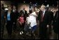 Laura Bush is greeted by three youngsters upon her arrival Monday, Sept. 19, 2005, to "Operation Compassion" at George R. Brown Convention Center in Houston. White House photo by Krisanne Johnson