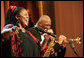 Jazz vocalist Lisa Henry and saxophonist Bobby Watson perform their version of "Kansas City" during the Thelonious Monk Institute of Jazz dinner Thursday night, Sept. 14, 2006, in the East Room of the White House. White House photo by Shealah Craighead