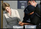 Mrs. Laura Bush looks on Friday, Nov. 21, 2008, as Ms. Maria Salguero Trillo, Community Health Educator Volunteer at the San Clemente Health Center in San Clemente, Peru, demonstrates how families are trained to treat contaminated water for safe drinking. In the town of 25,000, nearly 89 percent of the homes were affected by the August 2007, 8.0-magnitude earthquake. White House photo by Joyce N. Boghosian