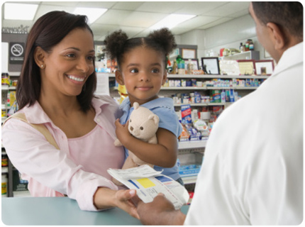 Mother and child pick up a prescription medication from the pharmacy