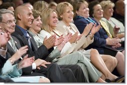 Mrs. Laura Bush, joined by, from left, Robert D. Coombe, Ph.D., Chancellor, University of Denver, Jordan Suniga, Student, Grace Keirnes, Student, and Lt. Governor Jane E. Norton, Lt. Governor of Colorado, attends the second regional Helping America's Youth Conference on Friday, August 4, 2006, in Denver, Colorado. According to the Department of Defense there are approximately 189, 000 children of deployed parents nationwide.  White House photo by Shealah Craighead