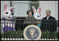 Mrs. Laura Bush and President George W. Bush welcome guests to the 2006 White House Easter Egg Roll, Monday, April 17, 2006, a tradition on the South Lawn of the White House since 1878. White House photo by Paul Morse