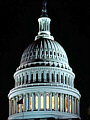 The Capitol dome lit up against a night sky.