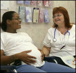 Photo: A pregnant woman consulting a healthcare professional