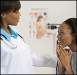 Photo: A woman consulting her healthcare professional.