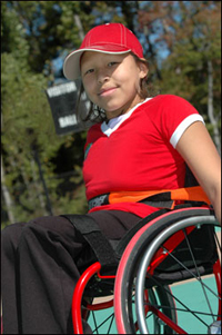 Photo: A smiling girl in a wheelchair