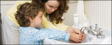 Photo: A mother and child washing hands