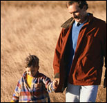 Photo: Father and son walking.