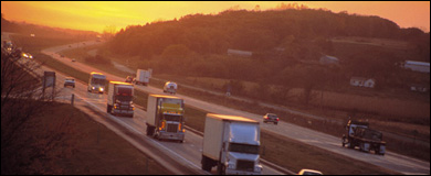 Photo: Cars and large trucks on highway