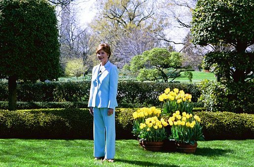 Laura Bush hosts a press preview of the White House Spring Garden Tour in the Jacqueline Kennedy Garden Friday morning, April 16, 2004. "I love this garden. I think the First Lady's Garden, Jacqueline Kennedy's Garden is so lovely," said Mrs. Bush to the press. "I particularly love the pavilion. And when the vines on top are thick, it's a shady spot to sit." The tour is open to the public Saturday and Sunday. Free, timed tickets are available at the Ellipse Visitor Pavilion located at 15th and E Streets on both tour days beginning at 7:30 a.m. White House photo by Susan Sterner