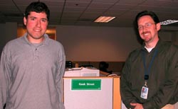 Frontline agent Alex Naron (l) with Phil Day, NIH Help Desk branch chief