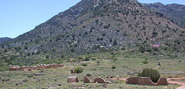 American flag flys behind ruins