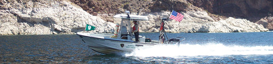 Ranger driving a boat on Lake Mead