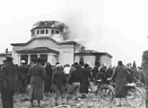 A crowd watches as a synagogue burns during <i>Kristallnacht</i>. Graz, Austria, November 9-10, 1938.