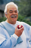 Photo of a man eating an apple. - Click to enlarge in new window.