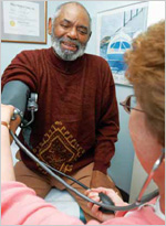 Photo of man getting his blood pressure checked