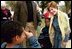 Mrs. Bush poses with children during her visit to the 2003 National Book Festival on the National Mall in Washington, D.C., Oct. 4, 2003.