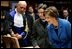 Laura Bush looks at an Ancient Thesis of Montichelli during a tour given by Paolo Novaria, Archives, left, at the University of Turin Saturday, Feb. 11, 2006, in Turin, Italy.