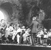 Dr. Herbert Zipper conducts the 50th anniversary performance of <i>Dachau Song</i> at the Autumn Festival. Graz, Austria, September 23, 1988.