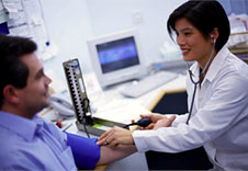 Image of doctor measuring a patient's blood pressure