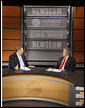 President George W. Bush speaks with Pastor Rick Warren Monday, Dec. 1, 2008, during President Bush's participation at the Saddleback Civil Forum on Global Health at the Newseum in Washington, D.C. White House photo by Eric Draper