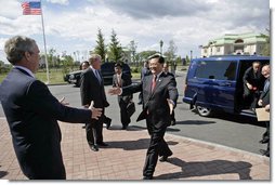 President George W. Bush welcomes President Hu Jintao of the People's Republic of China for a meeting at the G8 Summit in Strelna, Russia, Sunday, July 16, 2006. "The United Nations Security Council unanimously passed a resolution dealing with the North Korean issue, and I want to thank you for your leadership on that, Mr. President," said President Bush. "We're working together on the Iranian issue. We talked about the Middle East. I want to thank you very much for our continued dialogue on bilateral issues. White House photo by Eric Draper