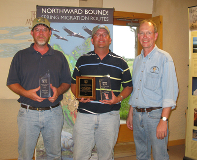 Kenny Dinan and Kirk Schroeder receiving ES Champions Award from Assistant Director, Gary Frazer