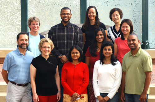 More than a dozen of the 45 employees of the NIH Intramural Sequencing Center can reflect on 5 years or more work experience at this trans-NIH facility. Among them are (front, from l) Dr. Gerry Bouffard, Alice Young, Dr. Baishali Maskeri, Jyoti Gupta and Quino Maduro; (middle, from l) Beatrice Barnabas and Richelle Legaspi; and rear (from l) Dr. Jenny McDowell, Charles Brinkley III, Shelise Brooks and Shi-Ling Ho.