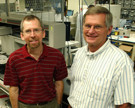 Dr. Eric Green (l), NHGRI scientific director and founding NISC director, and Robert Blakesley, director of the NISC sequencing group, are pictured in the state-of-the-art sequencing laboratory. 