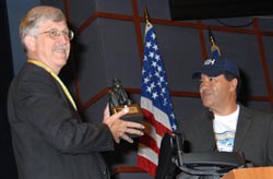 NHGRI director Dr. Francis Collins (l) accepts distinguished alumnus award from NIH director Dr. Elias Zerhouni.