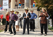 Several IC directors step-kick for the judges in front of Bldg. 1.