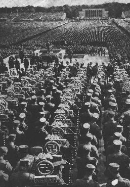 Rows of SA standard bearers line the field behind the speaker's podium at the 1935 Nazi Party Congress. Nuremberg, Germany, September 1935.