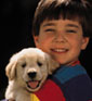 image of boy with puppy