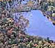 Photo: Aerial view of bog at Marcell Experimental Forest in Minnesota with trees in their fall colors.