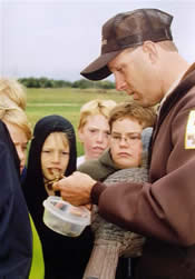 Man teaching students about wildlife