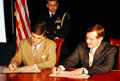 Maryland Governor Bob Ehrlich and HHS Secretary Mike Leavitt sign the Planning Resolution. HHS photo by Chris Smith