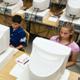 children in computer lab working