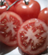 Photograph of sliced tomatoes.